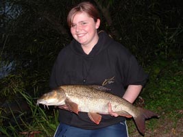 Beth Berridge with her pb Barbel of 8lb 2oz, caught using a Peregrine Barbel rod.